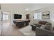 A game room features a pool table, sectional sofa, and natural light from a window at 4414 Walden St, Denver, CO 80249