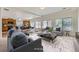 Open concept design featuring a cozy living room and breakfast bar creating a seamless transition at 4414 Walden St, Denver, CO 80249