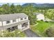 Scenic aerial view of the townhome complex, set among lush greenery and picturesque mountains at 404 Raspberry Ln, Monument, CO 80132