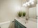 Stylish bathroom with a modern vanity, ample lighting, and a shower/tub combo at 404 Raspberry Ln, Monument, CO 80132