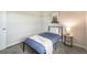 Comfortable bedroom with natural light, a bed with stylish linens, and modern decor at 404 Raspberry Ln, Monument, CO 80132
