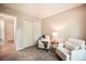 Comfortable bedroom featuring plush carpet, a large closet, and inviting seating area at 404 Raspberry Ln, Monument, CO 80132