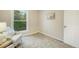 Bright bedroom featuring plush carpet, neutral walls, and a large window with wooded views at 404 Raspberry Ln, Monument, CO 80132