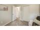 Bright bedroom with closet, neutral walls, soft carpeting, and a cozy seating area at 404 Raspberry Ln, Monument, CO 80132