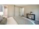 A well-lit bedroom with access to the bathroom featuring a stylish, comfortable bed at 404 Raspberry Ln, Monument, CO 80132