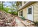 Charming home exterior featuring a cozy front porch with a small table and inviting curb appeal at 404 Raspberry Ln, Monument, CO 80132