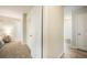 Bright hallway with multiple doors, including access to a bedroom, closet, and other rooms at 404 Raspberry Ln, Monument, CO 80132