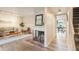Cozy living room with fireplace and modern lighting, creating a warm atmosphere at 404 Raspberry Ln, Monument, CO 80132
