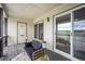 Relaxing outdoor porch area with comfortable seating and scenic views from sliding glass doors at 404 Raspberry Ln, Monument, CO 80132