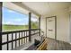 Inviting outdoor porch with comfortable seating and open views of the expansive green landscape at 404 Raspberry Ln, Monument, CO 80132