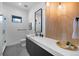 Sleek bathroom featuring modern fixtures, walk-in shower, and stylish vanity at 5815 Peppy San Cir, Sedalia, CO 80135