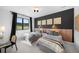Charming bedroom with twin beds, ample natural light, and stylish decor at 5815 Peppy San Cir, Sedalia, CO 80135