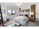 Bright bedroom featuring a large window with scenic views and decor at 5815 Peppy San Cir, Sedalia, CO 80135