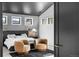 Comfortable bedroom featuring a dark ceiling, gray walls, and a luxurious seating area at 5815 Peppy San Cir, Sedalia, CO 80135