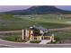 Stylish modern home with mountain views, featuring a three-car garage and manicured landscaping at 5815 Peppy San Cir, Sedalia, CO 80135