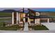 Stunning modern home with clean lines, stone accents, and professional landscaping at 5815 Peppy San Cir, Sedalia, CO 80135