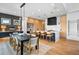 Modern kitchen with dining area featuring an island, bar seating, and ample cabinet space at 5815 Peppy San Cir, Sedalia, CO 80135