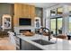 Bright living room featuring a modern fireplace, wood accents, and floor-to-ceiling windows at 5815 Peppy San Cir, Sedalia, CO 80135