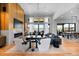 Bright living room with fireplace, modern furnishings, and large windows overlooking the landscape at 5815 Peppy San Cir, Sedalia, CO 80135