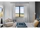 Comfortable bedroom with scenic views, modern decor, and comfortable lounging area at 5815 Peppy San Cir, Sedalia, CO 80135