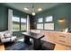 Stylish home office with built-in cabinets, modern lighting, and a scenic view of the landscape at 5815 Peppy San Cir, Sedalia, CO 80135