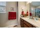 Bright bathroom features a framed mirror and decor at 12856 King St, Broomfield, CO 80020