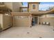 Inviting townhouse featuring an attached garage and a cozy front porch with space for seating and a grill at 12856 King St, Broomfield, CO 80020