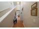 Bright hallway featuring hardwood floors and access to the living area, creating an inviting transition space at 12856 King St, Broomfield, CO 80020