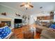 Open living space with hardwood floors, a fireplace, and seamless transition to the modern kitchen area at 12856 King St, Broomfield, CO 80020