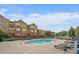 Community pool with lounge chairs and building views for relaxation at 12856 King St, Broomfield, CO 80020