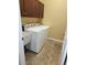 Laundry room featuring cabinets, a sink, and a washer and dryer at 5834 S Union Way, Littleton, CO 80127