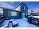 Snowy backyard with deck, grill, and partially visible fence at 4443 E Bennington Ave, Castle Rock, CO 80104