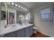 Main bathroom with double vanity and updated fixtures at 4443 E Bennington Ave, Castle Rock, CO 80104