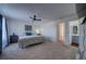 Main bedroom with ensuite bathroom access and ceiling fan at 4443 E Bennington Ave, Castle Rock, CO 80104