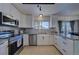 Updated kitchen, featuring stainless steel appliances and granite countertops at 4443 E Bennington Ave, Castle Rock, CO 80104