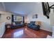 Spacious living room with hardwood floors and large windows at 4443 E Bennington Ave, Castle Rock, CO 80104