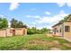 Spacious backyard featuring lush green lawn and shed, perfect for outdoor activities and storage at 6627 Eaton St, Arvada, CO 80003