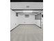 Basement featuring neutral carpet and black window trim at 6627 Eaton St, Arvada, CO 80003