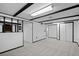 Basement featuring neutral carpet and white and black accents at 6627 Eaton St, Arvada, CO 80003