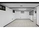 Basement featuring neutral carpet and black window trim at 6627 Eaton St, Arvada, CO 80003