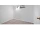 Bedroom featuring neutral carpet, bright white paint, and a small window at 6627 Eaton St, Arvada, CO 80003