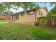 Charming brick home with well-maintained front yard and privacy fence at 6627 Eaton St, Arvada, CO 80003