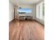 Bright living room with hardwood floors and modern television at 6627 Eaton St, Arvada, CO 80003
