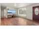 Bright living room with hardwood floors and large window at 6627 Eaton St, Arvada, CO 80003