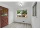 Room featuring vinyl wood flooring and a window view of the backyard at 6627 Eaton St, Arvada, CO 80003