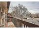 Private balcony overlooking a tree and parking area at 14590 E 2Nd Ave # 304B, Aurora, CO 80011