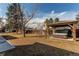 Backyard with gazebo-covered hot tub, grassy area, and surrounding fence at 6111 W Maplewood Pl, Littleton, CO 80123