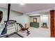 Basement featuring exercise equipment and ample storage space for functional living at 6111 W Maplewood Pl, Littleton, CO 80123