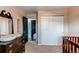 Spacious Bedroom with dark wooden dresser, closet, and room for a crib at 6111 W Maplewood Pl, Littleton, CO 80123