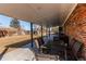 Cozy outdoor patio with dining table and chairs, perfect for entertaining guests at 6111 W Maplewood Pl, Littleton, CO 80123